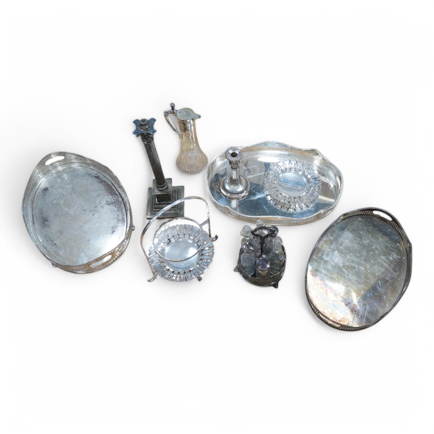 A collection of various silver plated wares including an Art Nouveau claret jug, trays, Corinthian column table lamp etc. Condition - varies